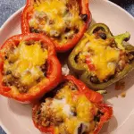 Taco Stuffed Peppers close-up with melted cheese and beef filling